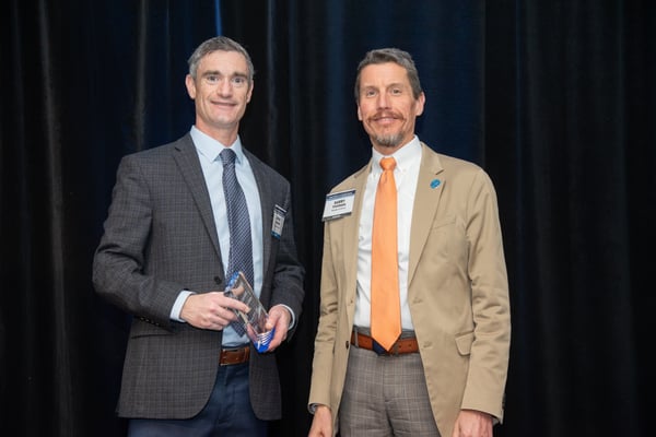 Brian Lennon (left), president and CEO of General Die Casters, receives the Evolution of Manufacturing Award.